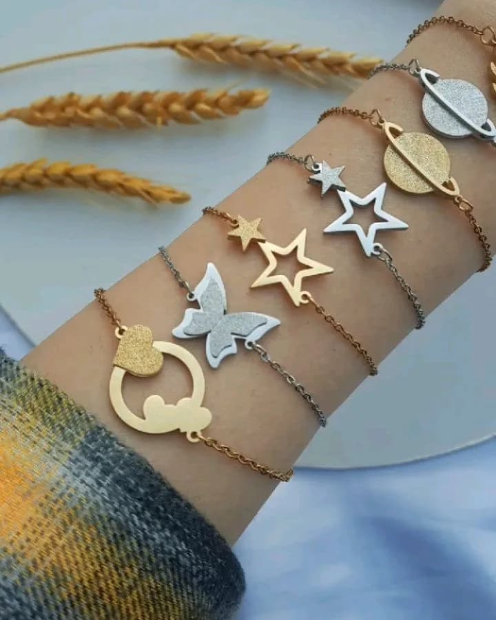 دستبند شاین، رنگ طلایی و نقرهای، جنس فلز و استیل، زنجیری با پلاک آویز