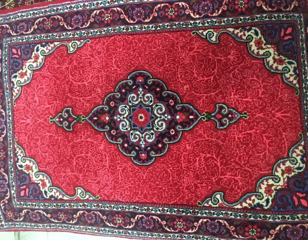 فرش دستباف جوزان، رنگ قرمز، سرمهای و آبی، طرح گلدار، مستطیلی، ترنجدار