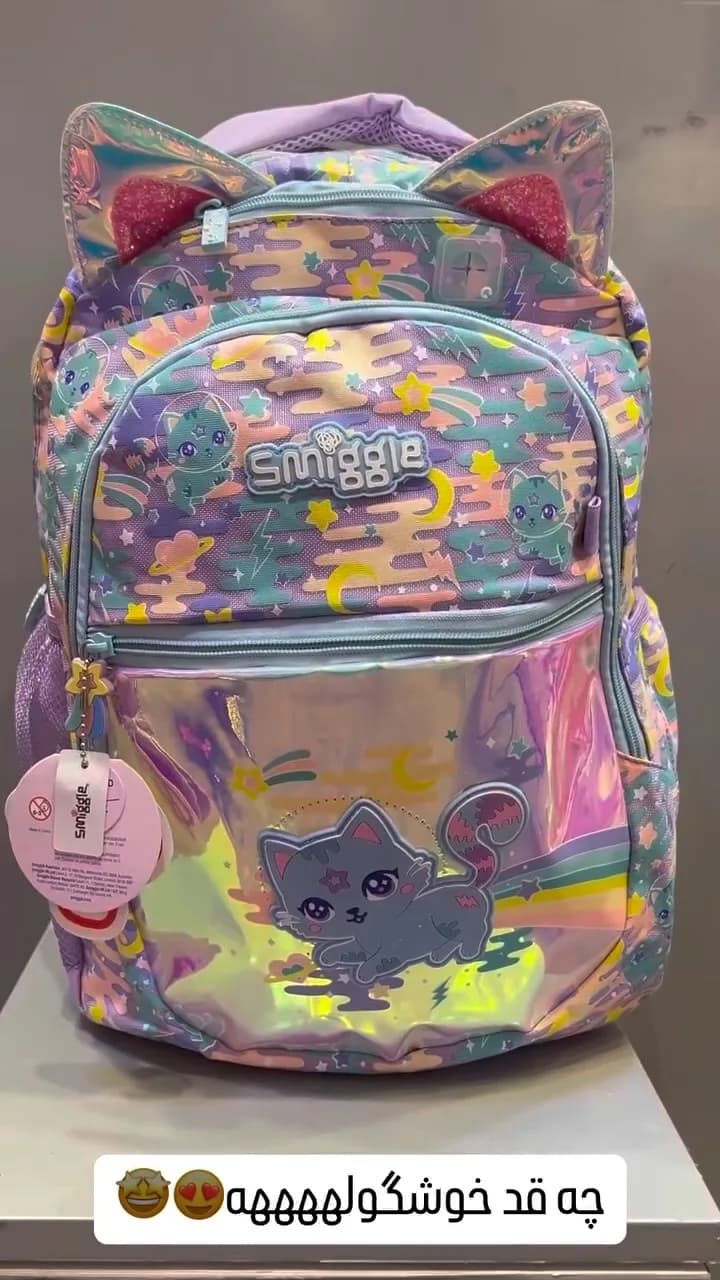 کوله پشتی اسمیگل Smiggle، رنگ بنفش، صورتی و آبی، طرح شخصیت کارتونی
