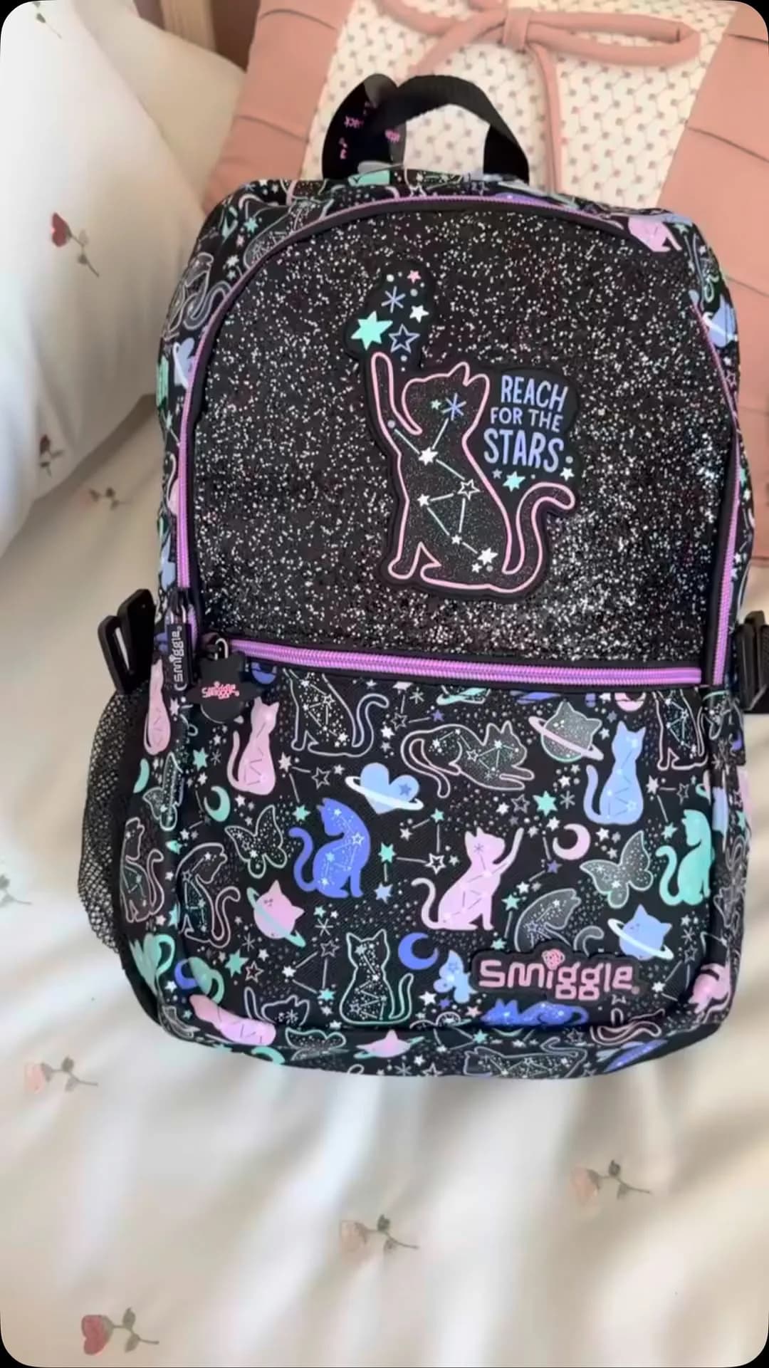کوله پشتی اسمیگل Smiggle، رنگ مشکی، صورتی و بنفش، جنس چرم مصنوعی و اکلیل، طرح طرح کارتونی، کوله پشتی مدرسه