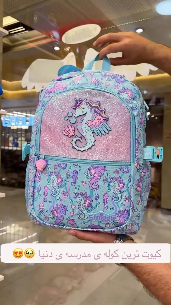 کوله پشتی اسمیگل Smiggle، رنگ آبی، صورتی و بنفش، جنس چرم مصنوعی، طرح طرح کارتونی، کوله پشتی مدرسه
