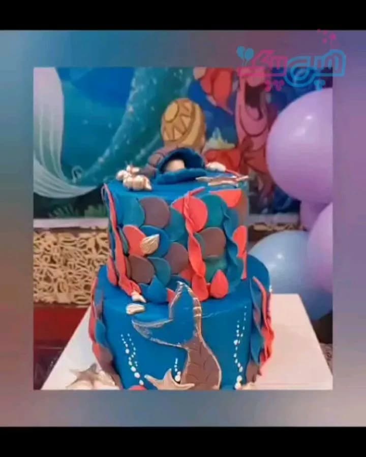 تم تولد پری دریایی، رنگ آبی، قرمز و قهوه‌ای، جنس خامه و فوندانت، طرح شخصیت کارتونی، دو طبقه، مدل پری دریایی