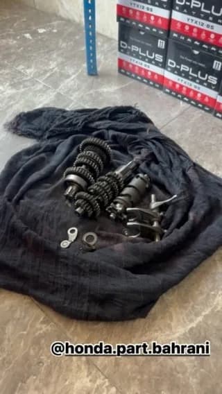 گیربکس ۶ دنده ایکسل ژاپنی، رنگ مشکی و نقرهای، جنس فلز و پارچه، مجموعهای از چرخدندهها