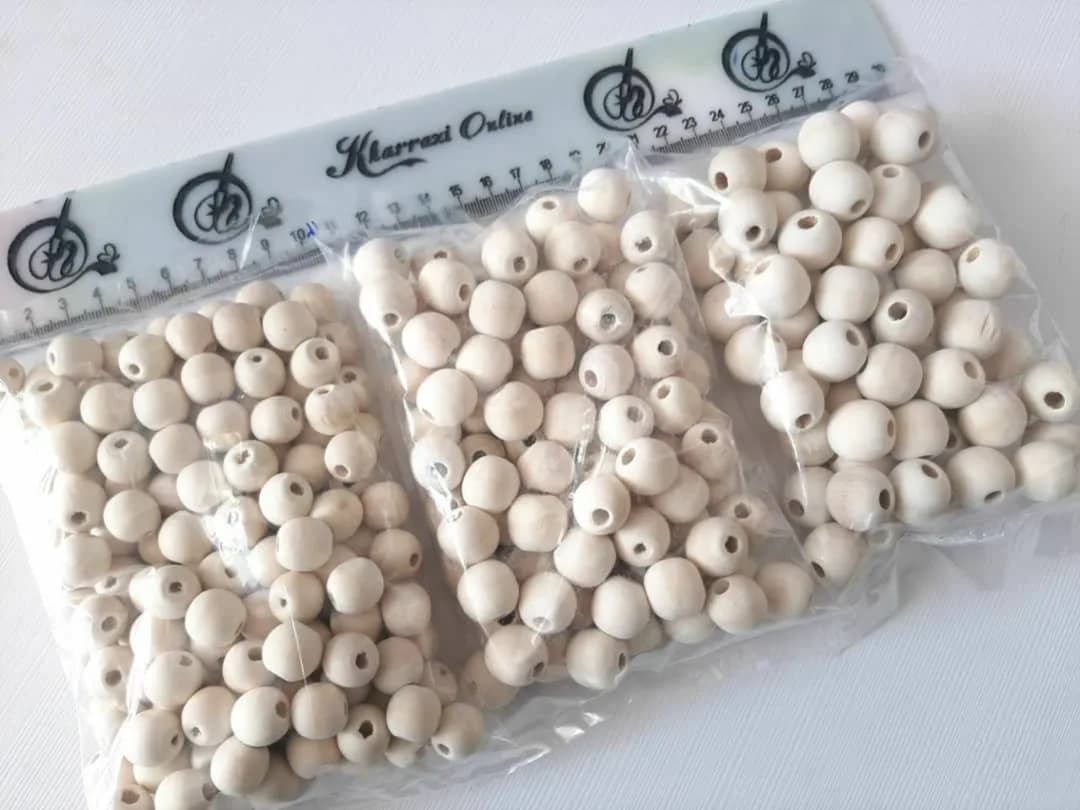 پک ۳۰۰ گرمی مهره چوبی — رنگ کرم — نمای بستهبندی — ۳۰۰ گرم