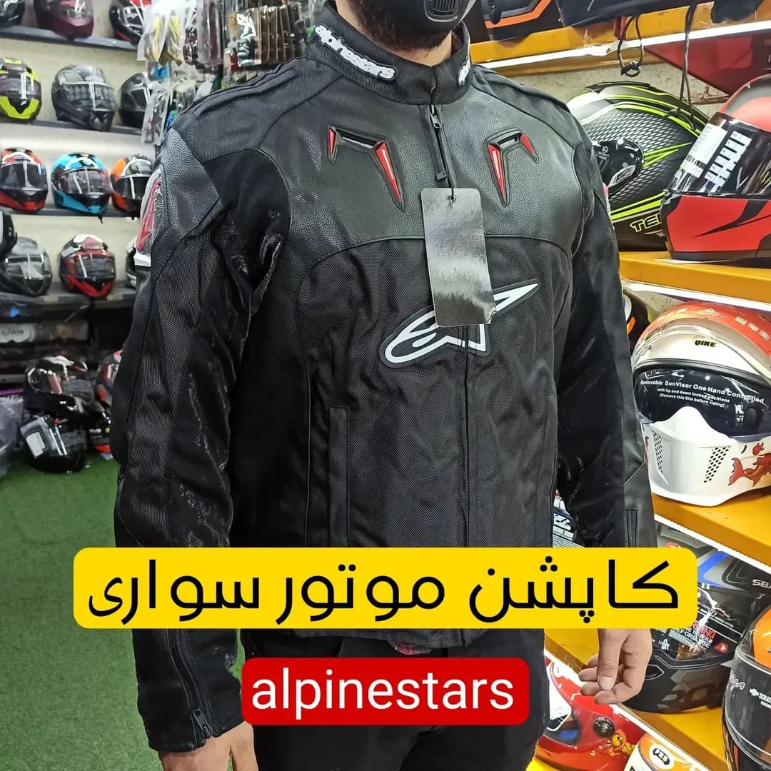 کاپشن موتورسواری چرم و برزنت، رنگ مشکی و قرمز، جنس پارچه، یقهدار، آستین بلند، جذب