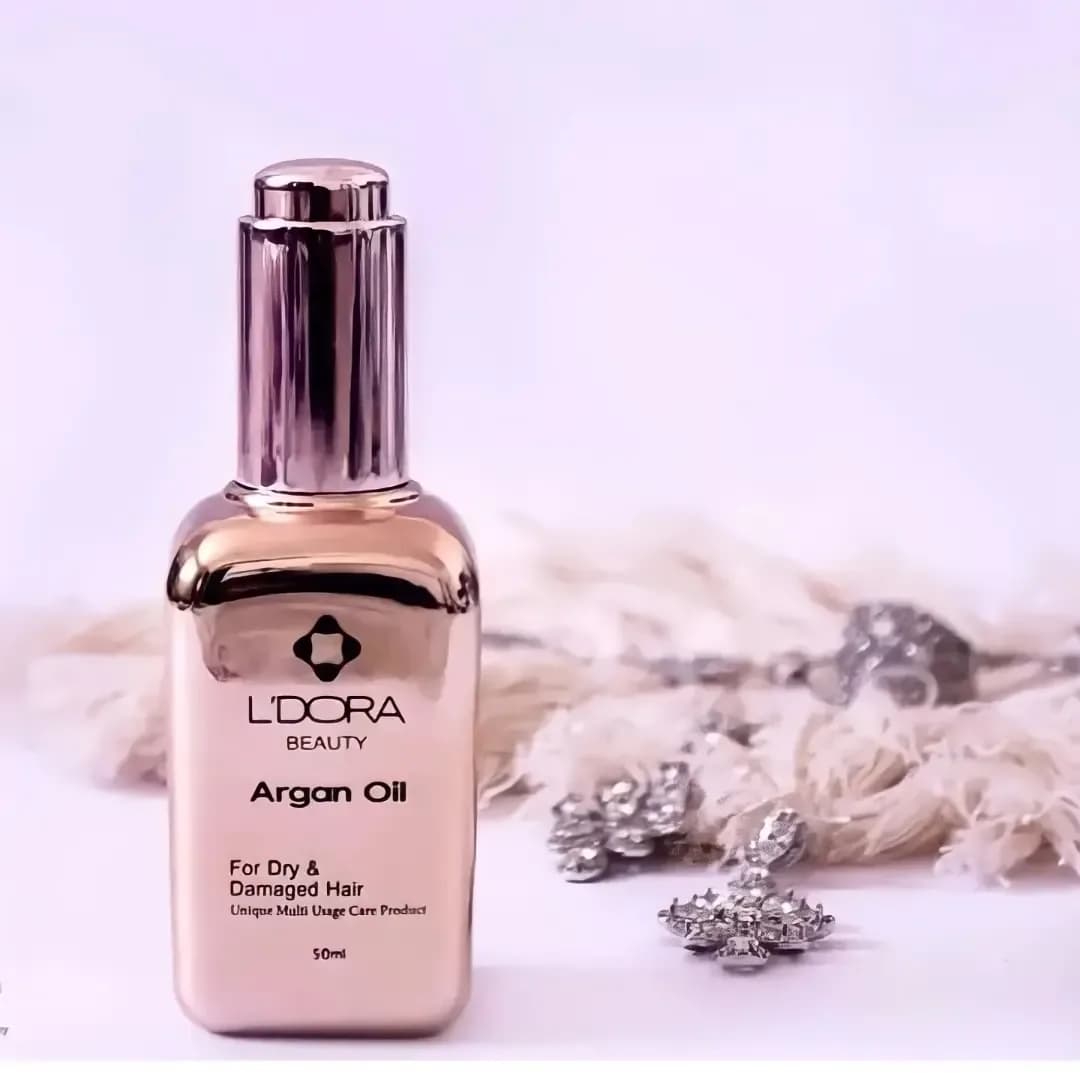 روغن آرگان لدورا، رنگ طلایی و بژ، جنس شیشه و پلاستیک، بطری قطرهچکان