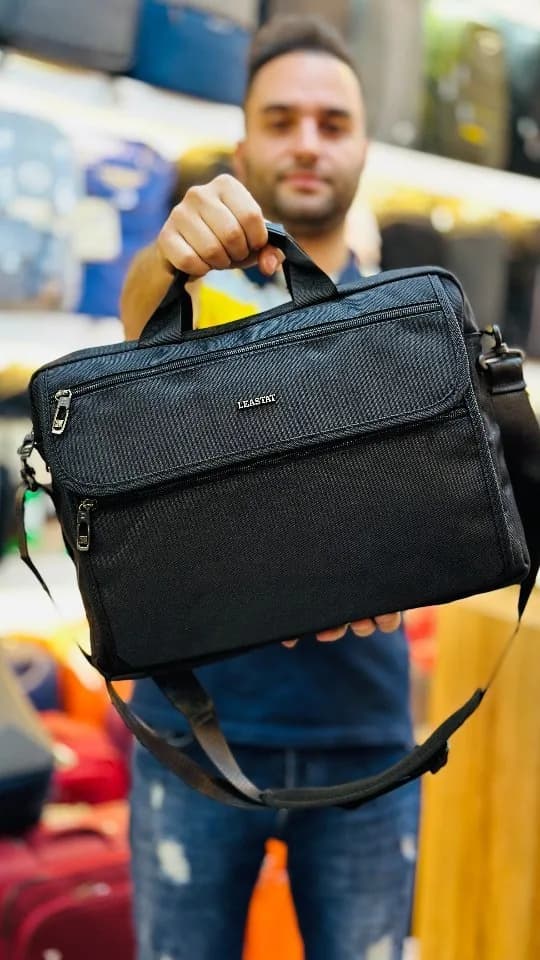 کیف دانشجویی اداری لیستات، رنگ مشکی، جنس پارچه، دوشی، مستطیلی، بند پهن