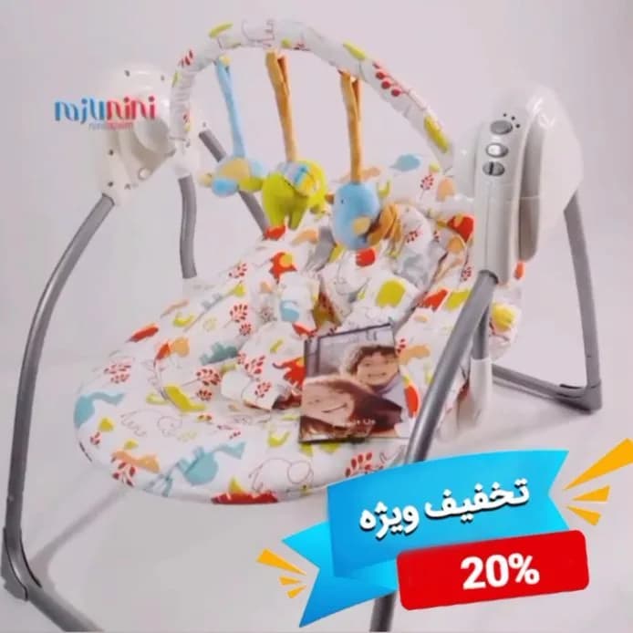 تاب نوزاد ایون فلو، رنگ سفید و خاکستری، جنس فلز و پارچه، طرح گلدار، تاشو، موزیکال