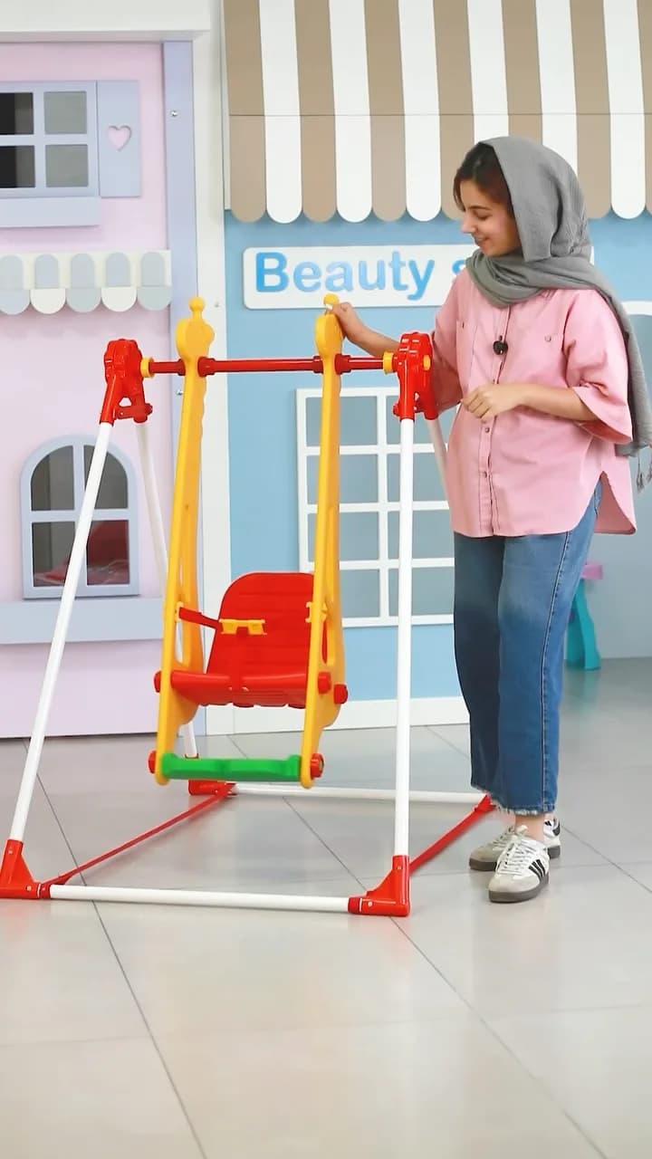 تاب کجاوه‌ای کودک طرح زرافه، رنگ قرمز، زرد و سفید، جنس پلاستیک، پایه‌دار فلزی