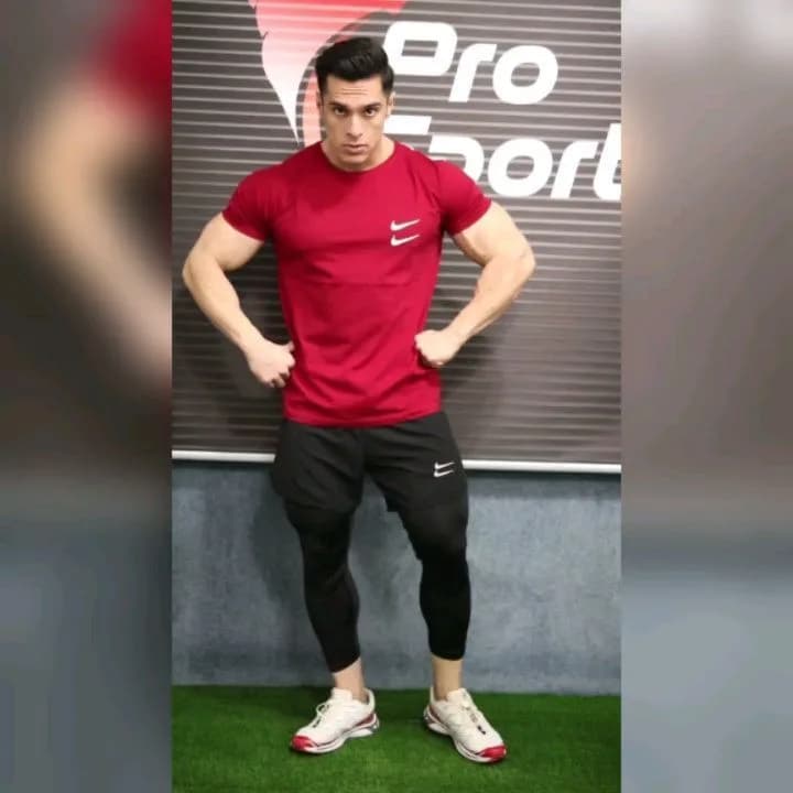 ست تیشرت و شلوارک لگدار ورزشی، رنگ قرمز، آستین کوتاه، یقه گرد، جذب