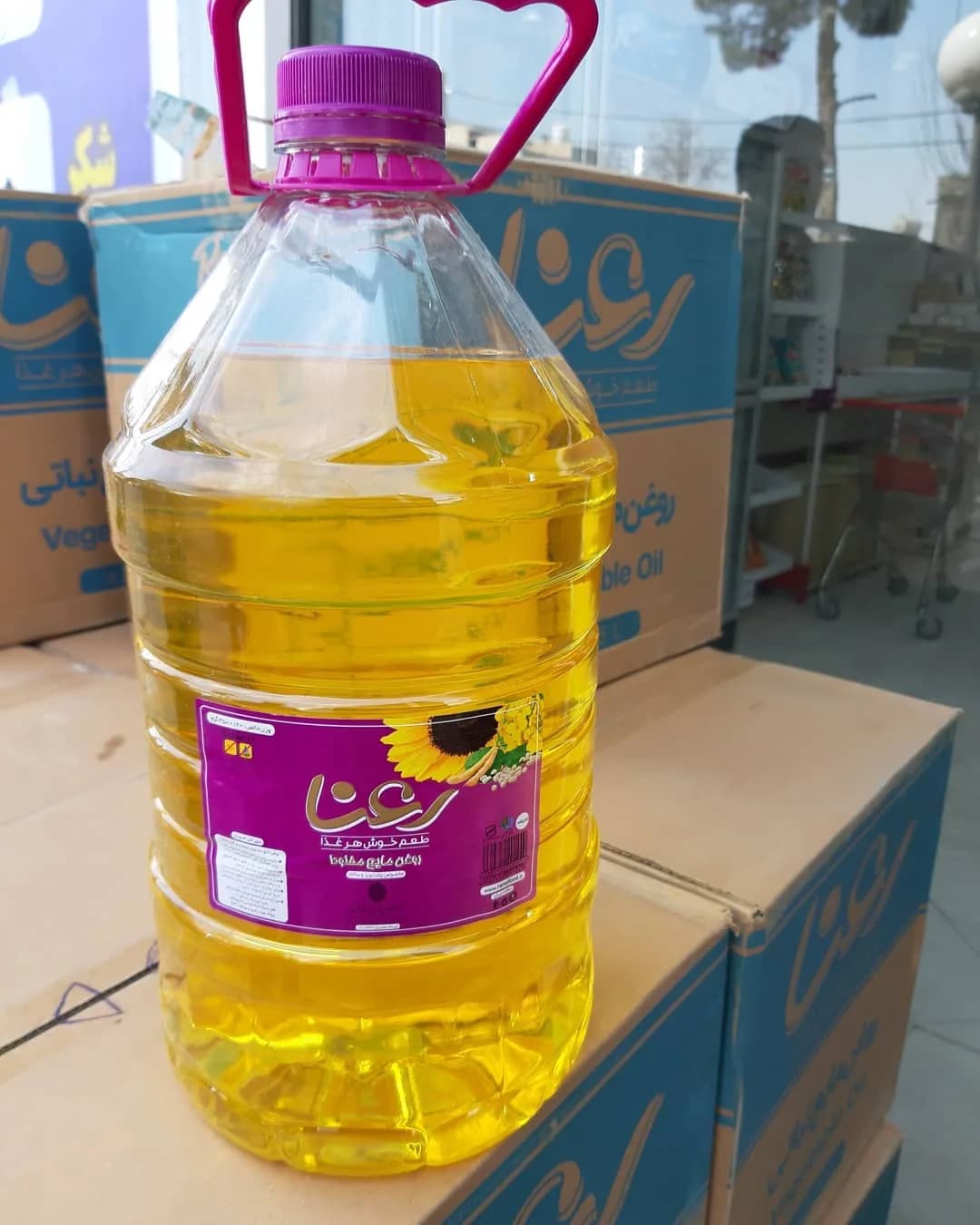 روغن مایع پخت و پز و سرخ کردنی رعنا، رنگ زرد، بنفش و سفید، جنس پلاستیک، ظرف پلاستیکی بزرگ با دسته