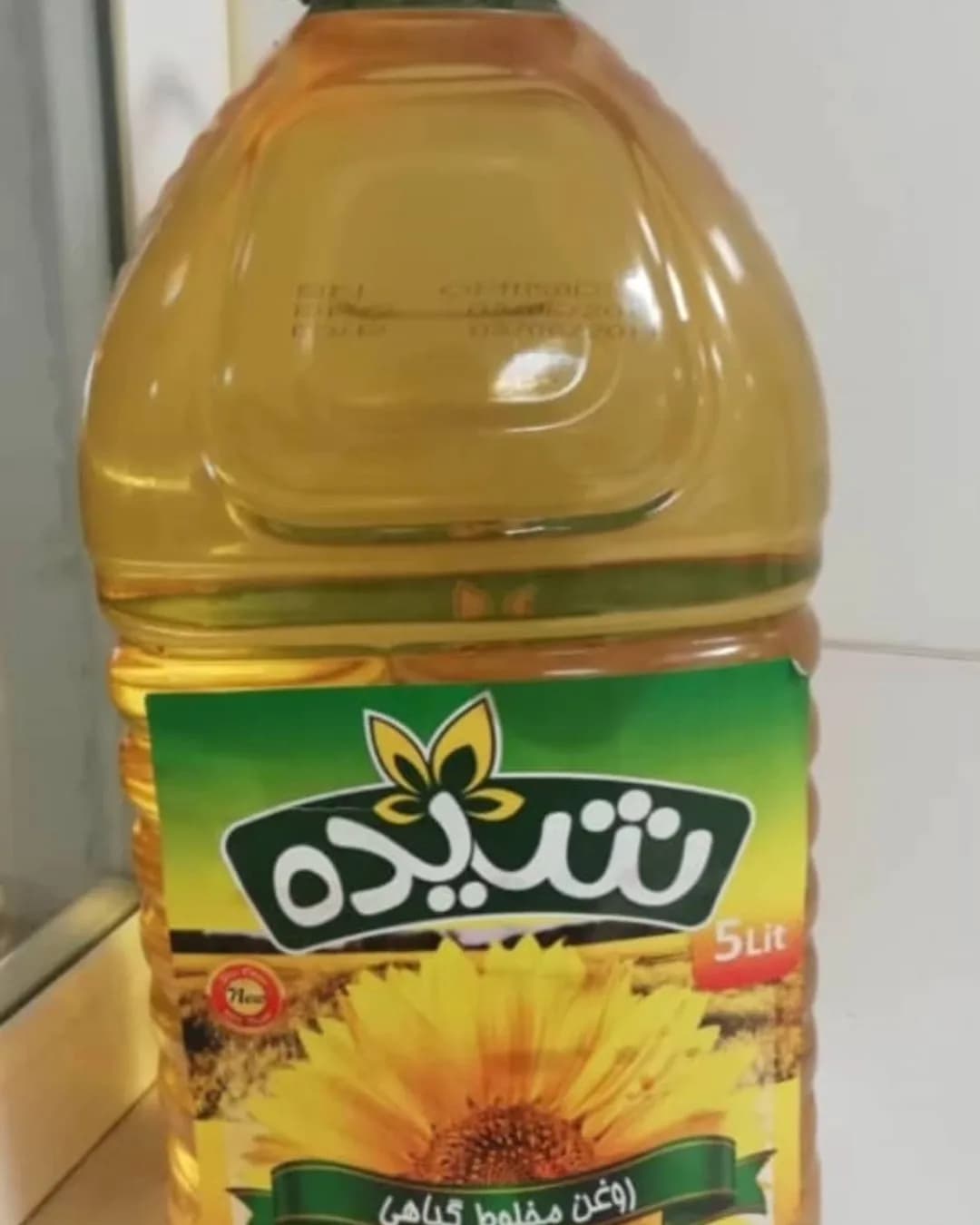 روغن مایع ۵ لیتری شیده، رنگ زرد و سبز، جنس پلاستیک، طرح گلدار، بطری ۵ لیتری