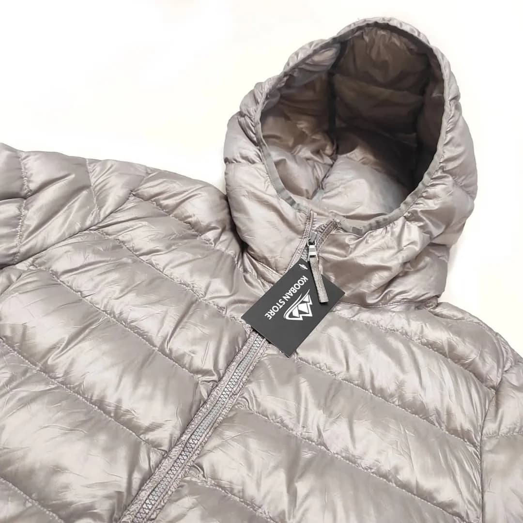 کاپشن کوهنوردی سایز M UNIQLO، رنگ خاکستری، کلاهدار، زیپدار