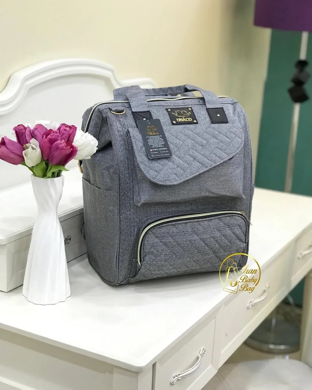 کیف لوازم نوزاد مدل دنیز یوناکو، رنگ خاکستری، کوله و دستی