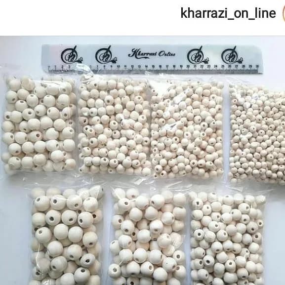مهره چوبی بدون رنگ ۹ سایز — رنگ کرم — نمای دردست — سایزهای ۸ تا ۲۰