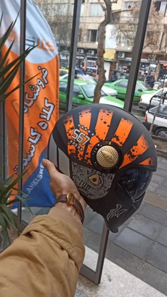 کلاه کاسکت طلق متحرک، رنگ مشکی و نارنجی، جنس پلاستیک، طرح هندسی، تمام صورت