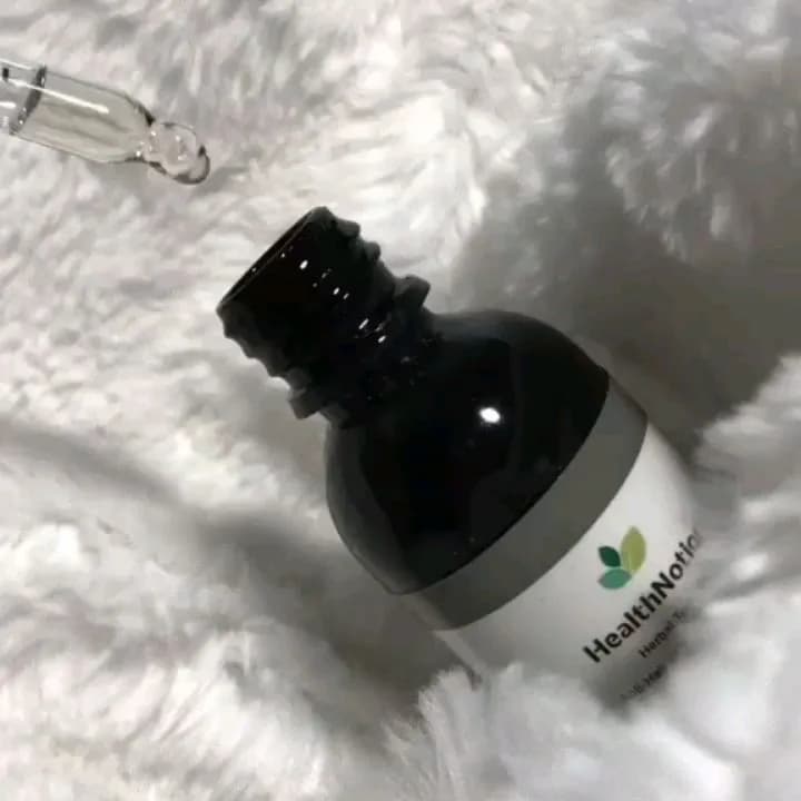 روغن مو ضد ریزش هلث نوشن، رنگ قهوهای تیره، جنس شیشه، بطری کوچک