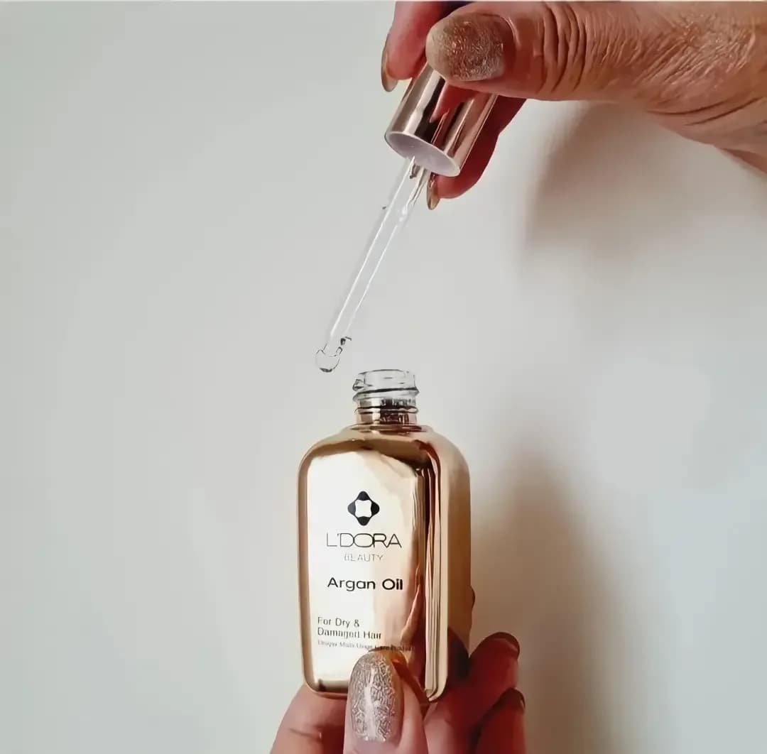روغن آرگان لدورا، رنگ طلایی و شفاف، جنس شیشه، بطری قطرهچکان