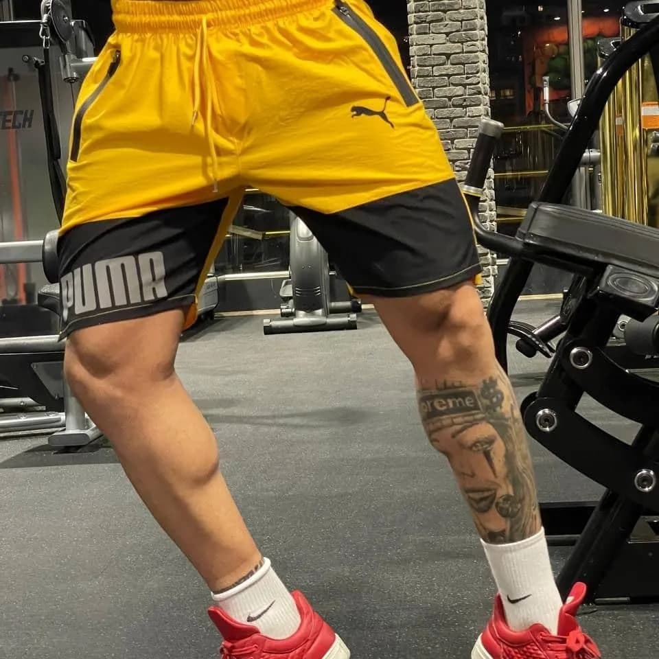 شلوارک ورزشی حرفهای کتان Puma، رنگ زرد و مشکی، کوتاه، بنددار، جذب