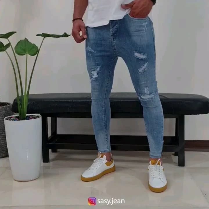 شلوار جین کجراه دمپا زیپ، رنگ آبی، جذب، پاره