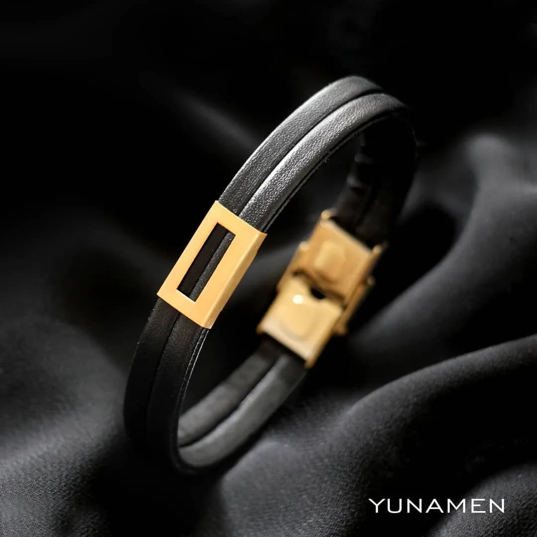 دستبند چرم مشکی و طلا مردانه یونامن، رنگ طلایی، جنس استیل، دستبند مردانه دورشته
