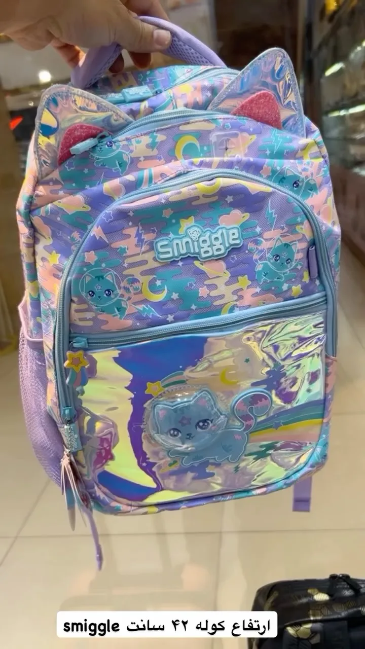 کوله پشتی اسمیگل ۴۲ سانت Smiggle، رنگ بنفش، آبی و صورتی، طرح شخصیت کارتونی، کوله پشتی با گوش گربه