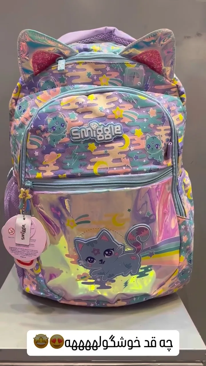 کوله پشتی اسمیگل Smiggle، رنگ بنفش، صورتی و آبی، طرح شخصیت کارتونی