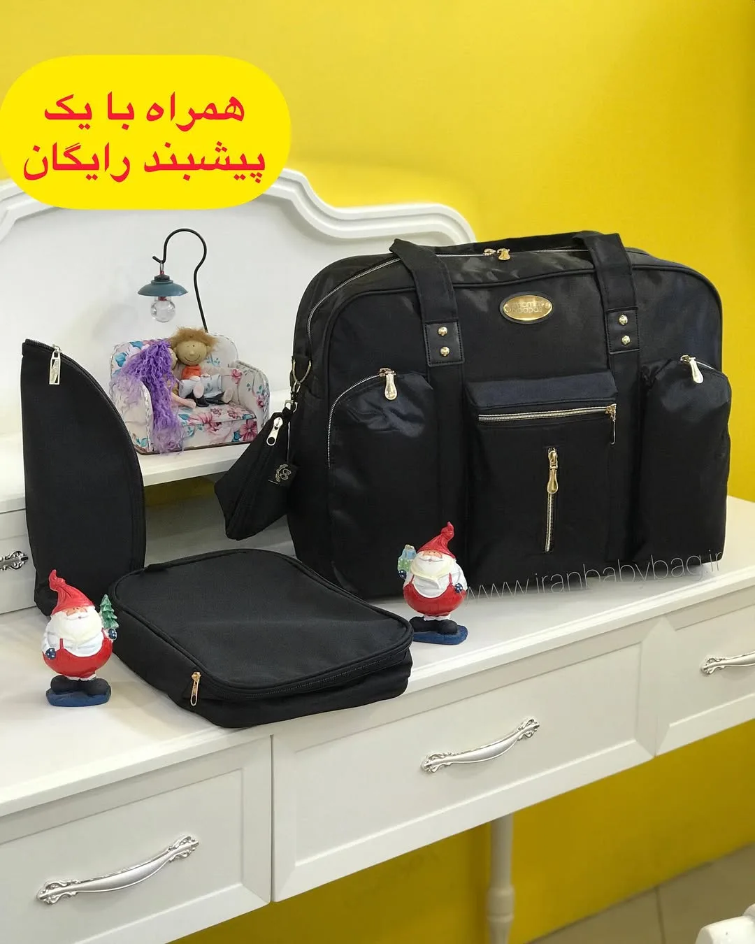 ساک لوازم نوزاد مدل ماماس اند پاپاس، رنگ مشکی و طلایی، جنس برزنت، کوله و دستی