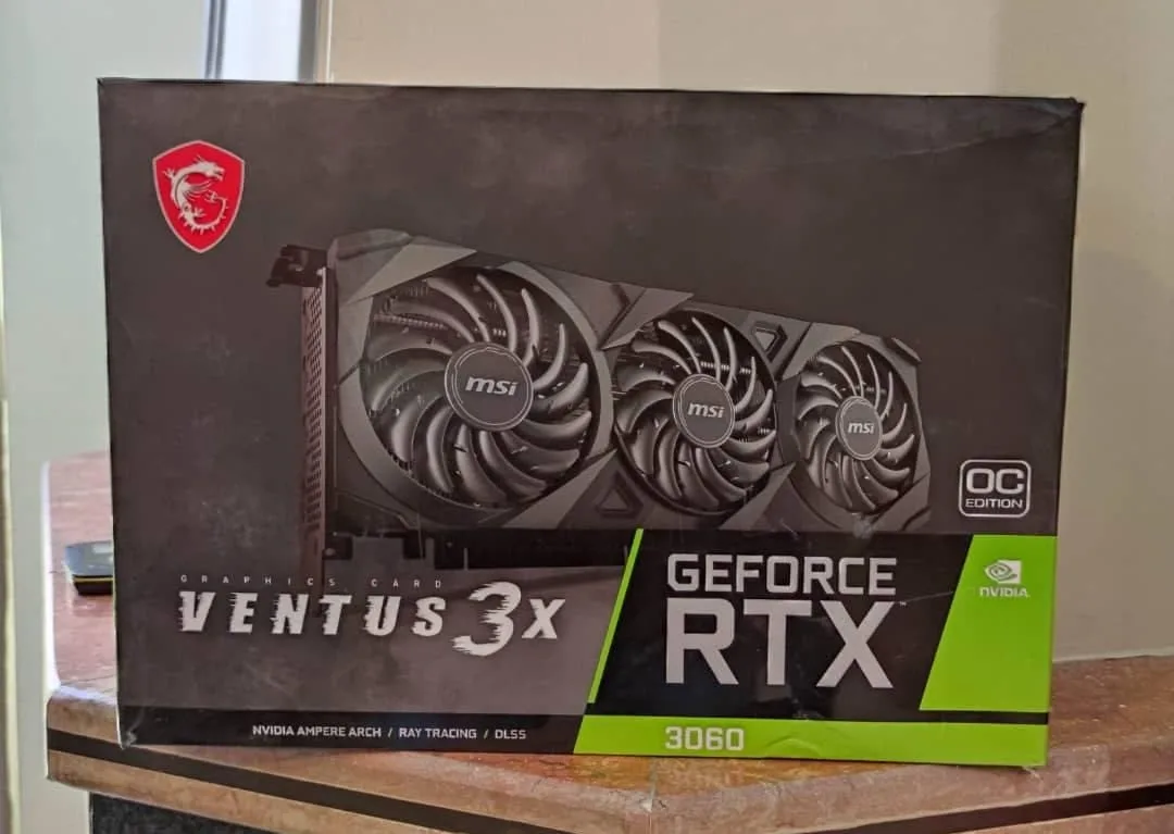 کارت گرافیک MSI RTX 3060 VENTUS 3X OC ام اس آی، رنگ مشکی و سبز، جنس مقوا، طرح تصویر کالا، جعبه سخت‌افزاری