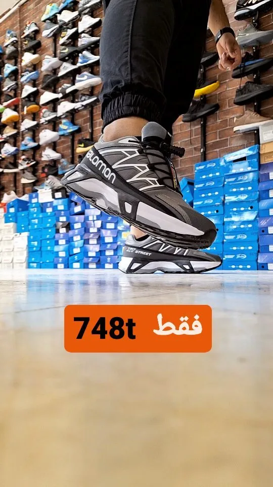 کتانی سالومون سایز ۴۱ تا ۴۴، رنگ خاکستری، مشکی و سفید، پاشنه تخت