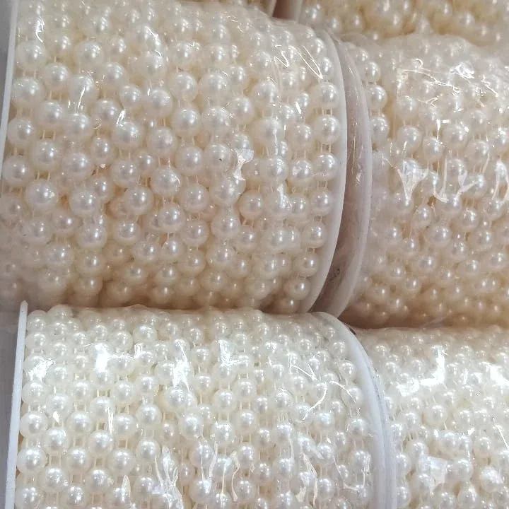 مروارید لپه‌ای شیری رولی — رنگ شیری — نمای در‌دست — نیم‌گرد — عکس ۵