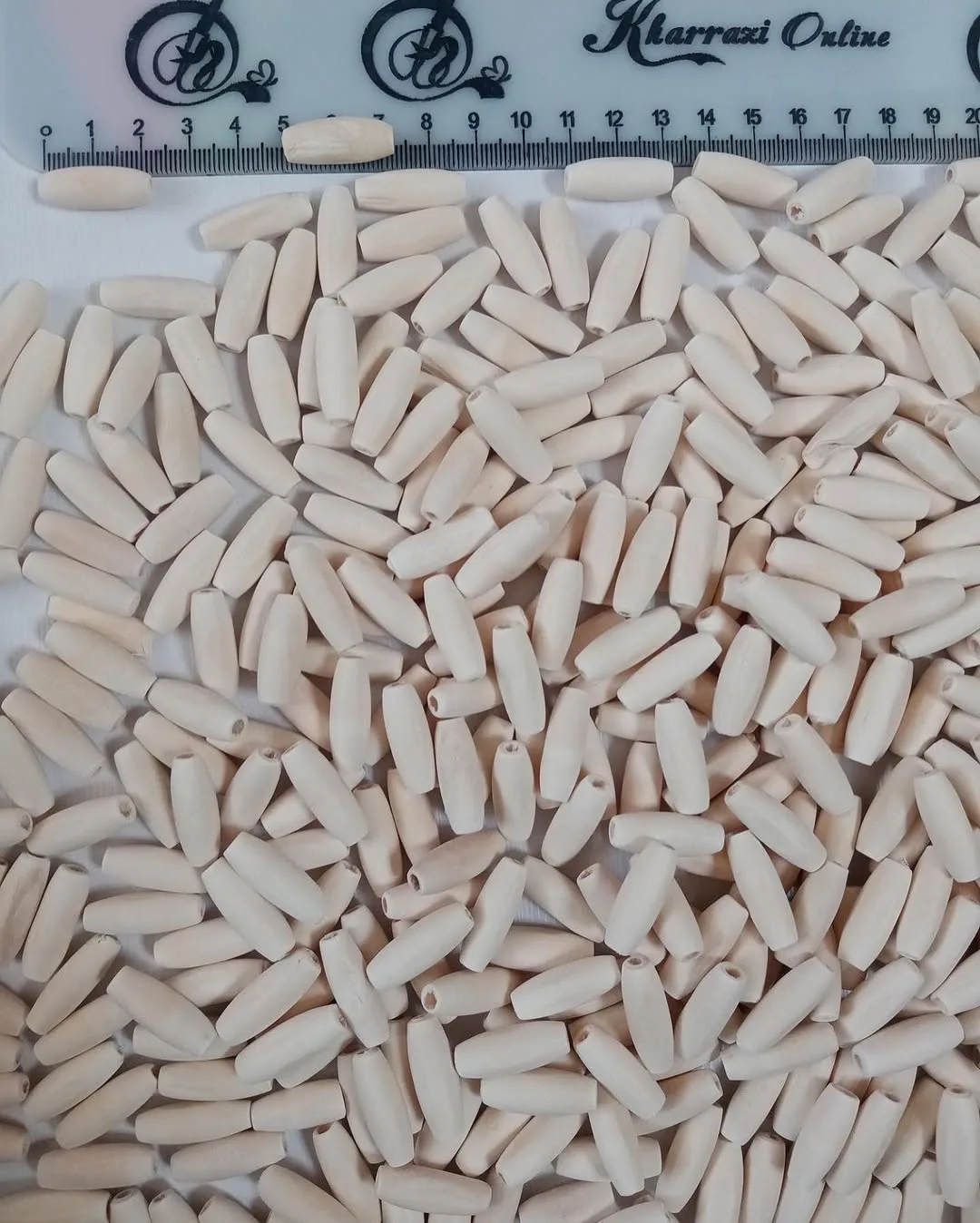 مهره چوبی — رنگ کرم — نمای در‌دست — اشکال بیضی و استوانه — عکس ۵