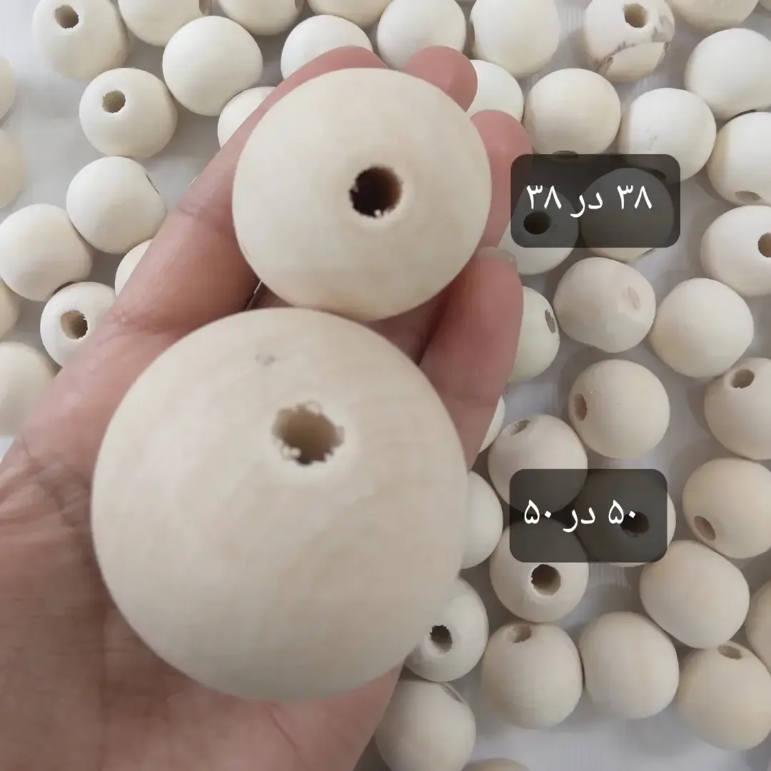 مهره چوبی ۸ تا ۲۳ میل — رنگ کرم — نمای در‌دست — سایزهای ۸ تا ۵۰ میل — عکس ۵