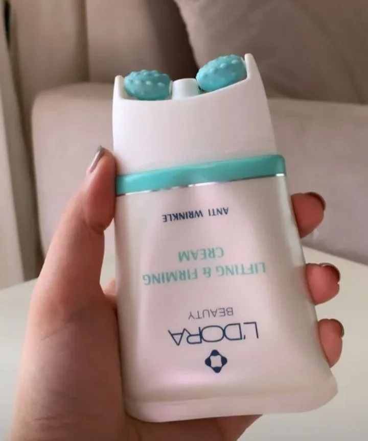کرم لیفتینگ صورت لدورا، رنگ سفید و فیروزه‌ای، جنس پلاستیک، تیوب ماساژوردار غلتکی