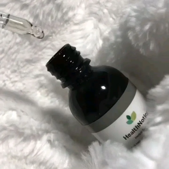 روغن مو ضد ریزش هلث نوشن، رنگ قهوه‌ای تیره، جنس شیشه، بطری کوچک