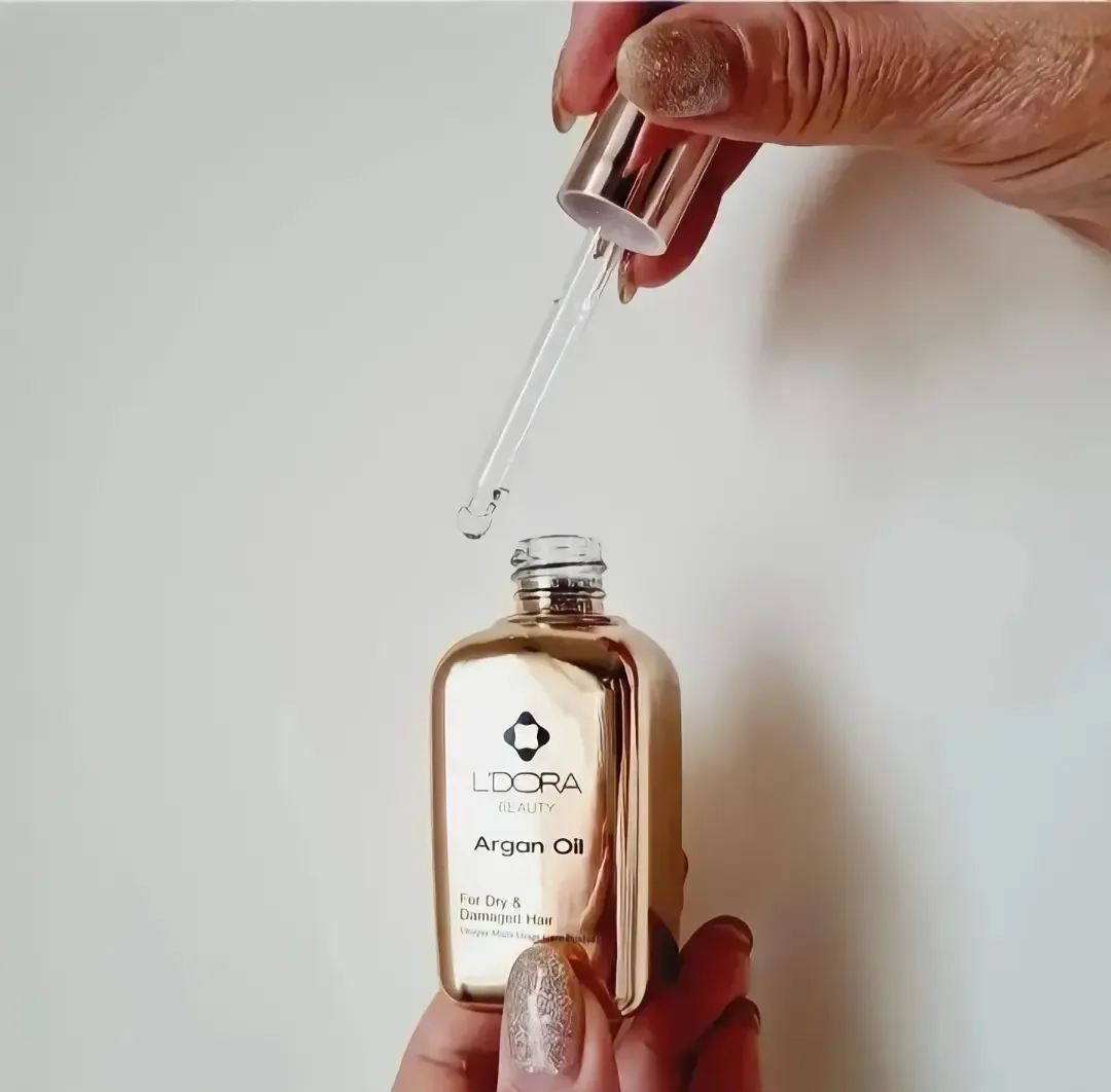 روغن آرگان لدورا، رنگ طلایی و شفاف، جنس شیشه، بطری قطرهچکان