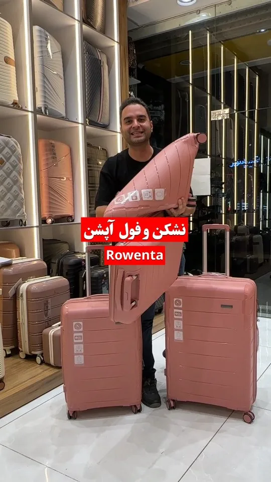 چمدان کالباسی روونتا، رنگ صورتی، جنس پلاستیک، چمدان سخت، چرخدار