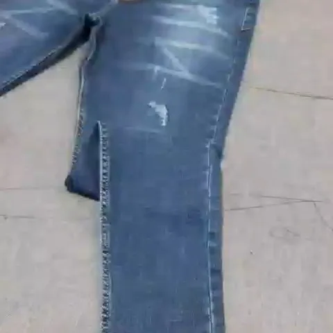شلوار جین پارچه کجراه، رنگ آبی، جذب، پاره
